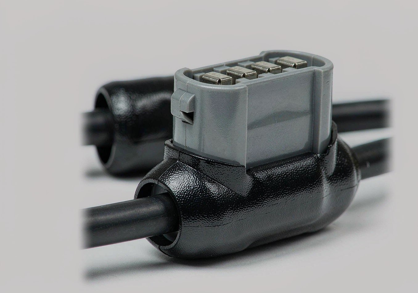 Over-molded cable assembly with moulded strain-relief boot