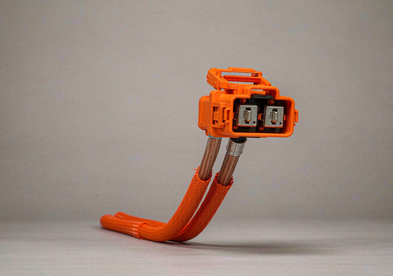 EV high-voltage battery harness with orange high-voltage connectors